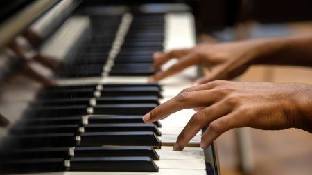 A man plays piano.