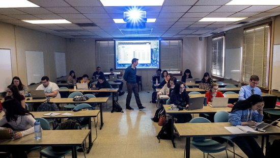 A man teaches in a classroom.
