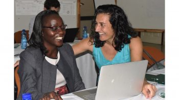 Mina Hosseinipour talks with Cecilia Kanyama, lead of the AIDS Clinical Trials Group and an internal medicine physician with UNC-Project Malawi, at a recent scientific workshop.