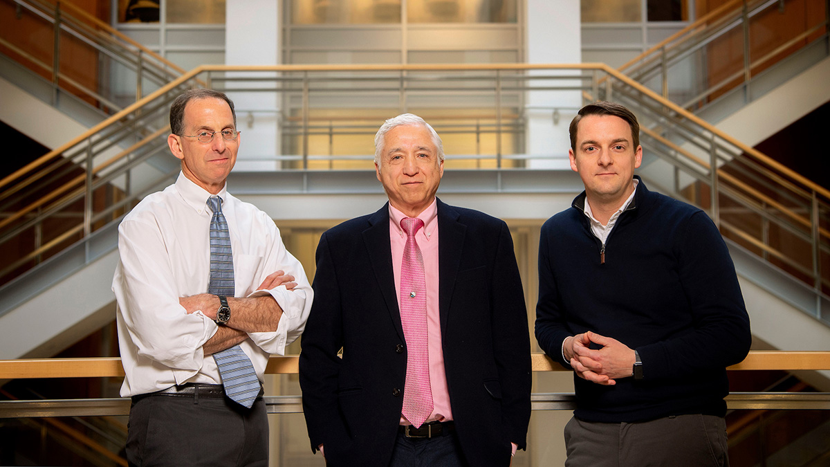 Dr. David Margolis, J. Victor Garcia and Richard Dunham in the Genetic Medicine Building.