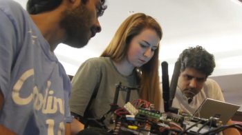Students work on a remote-controlled car.