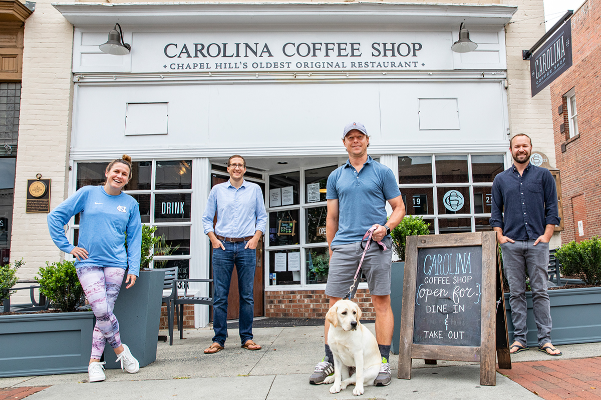 Heather O’Reilly, Clay Schossow, David Werry and Jeff Hortman stand outside the Carolina Coffee Shop.