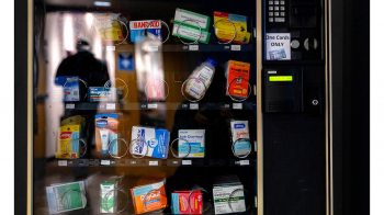 A vending machine with health care products in it.
