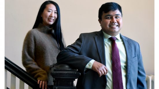 Jiayi Bao and Abhisekh Ghosh Moulick stand together near stairs.