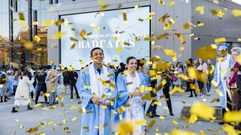 Graduates celebrate with confetti