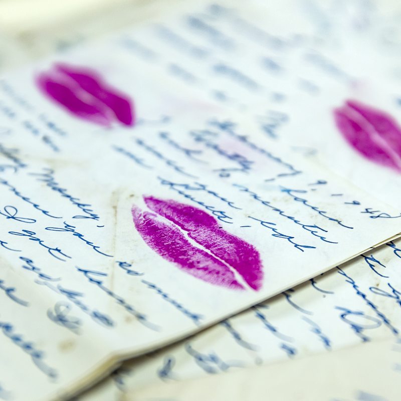 Letters with purple lipstick on it.