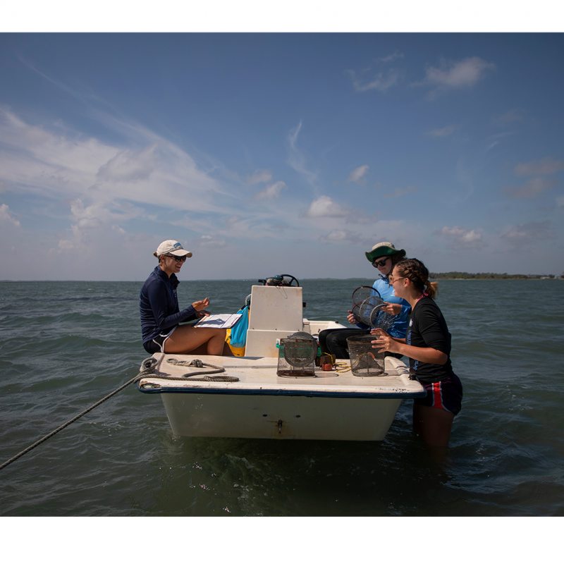 Three people in a boat.