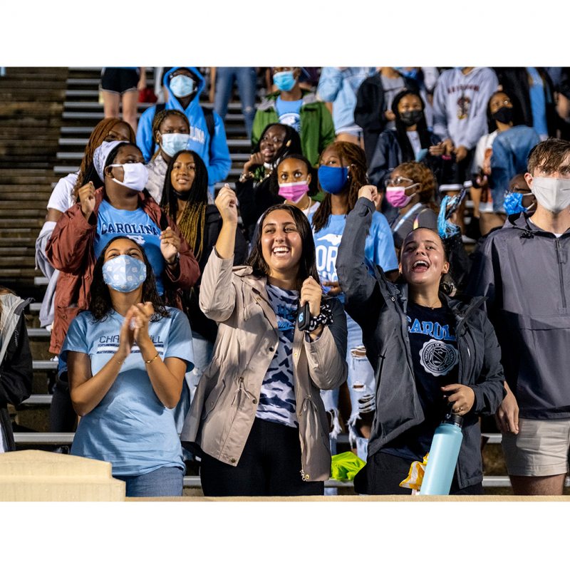 Student cheering in the stands of Kenan Stadium.