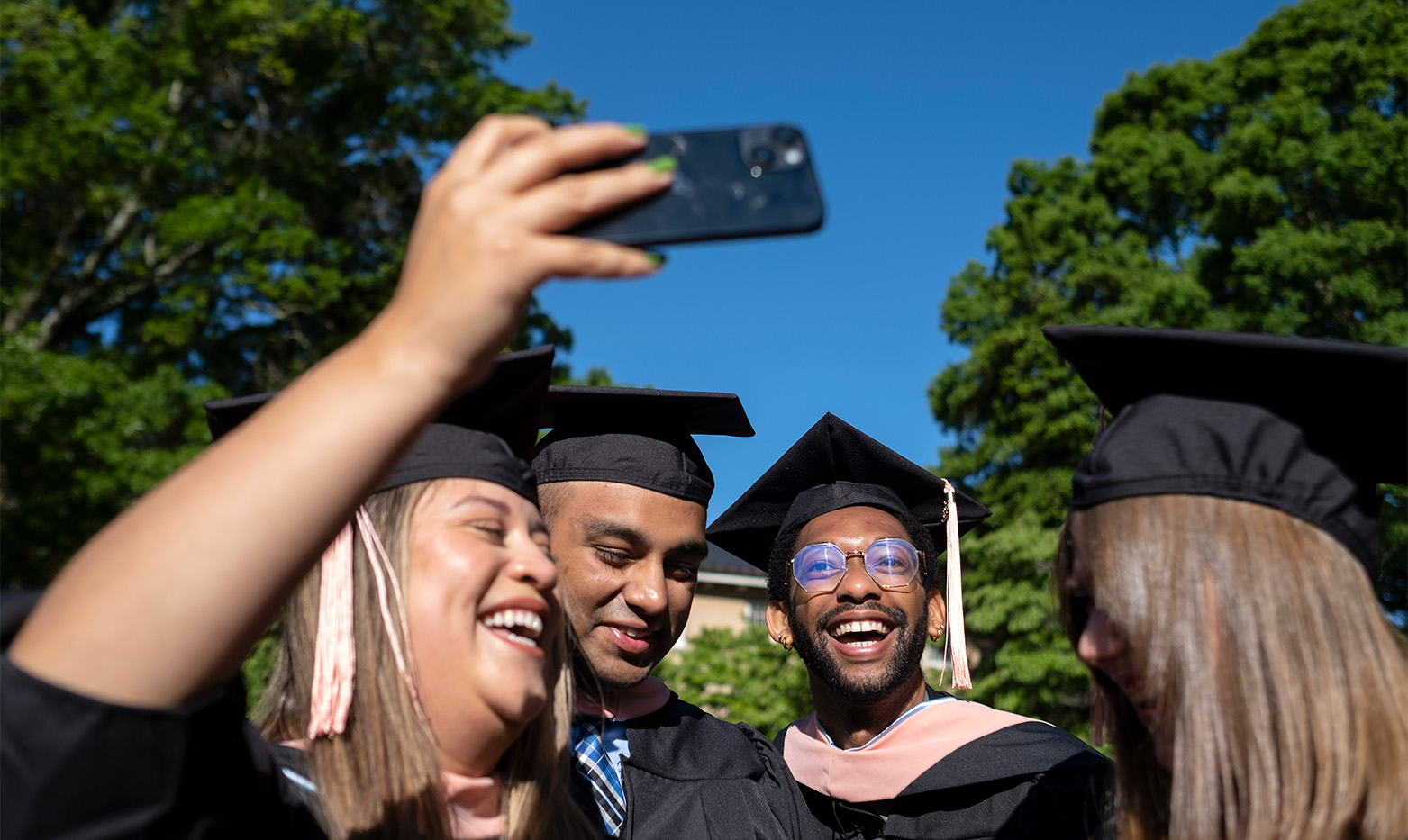 UNC students take a selfie in graduation