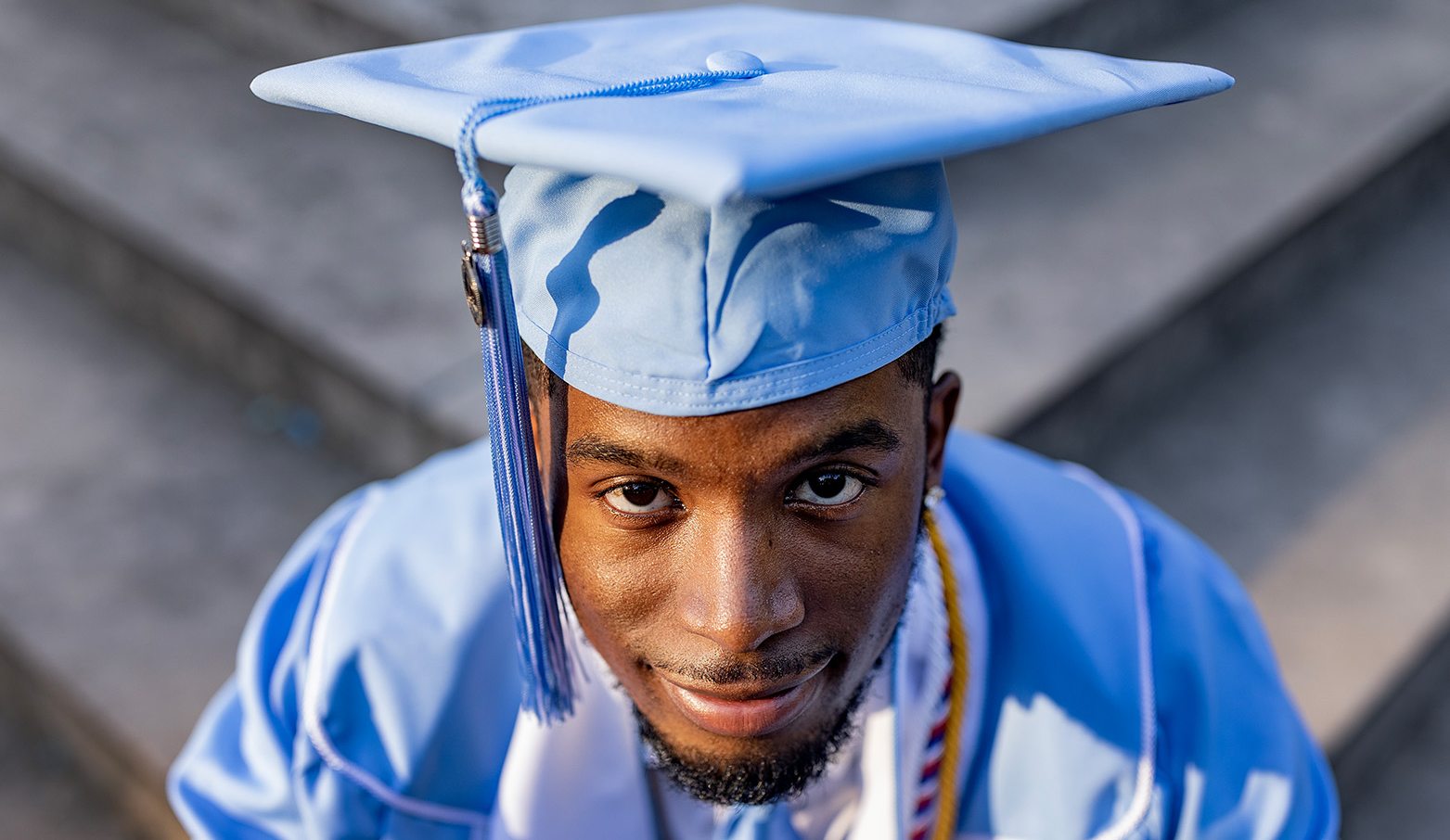 A UNC students wearing a graduation cap.