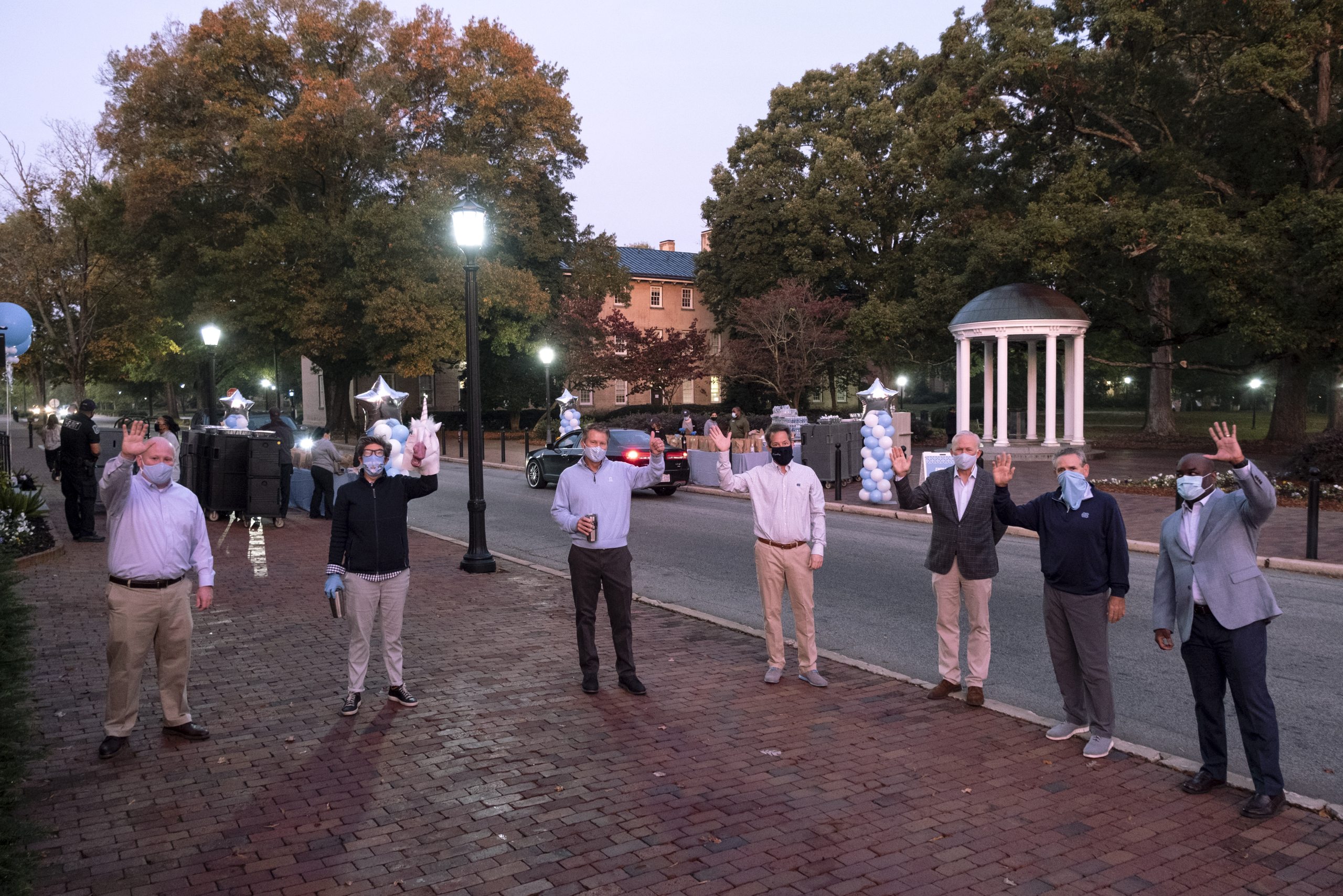 Campus leaders gathered in front of the Old Well at sunrise to hand out breakfast to show their appreciation to the University's employees.