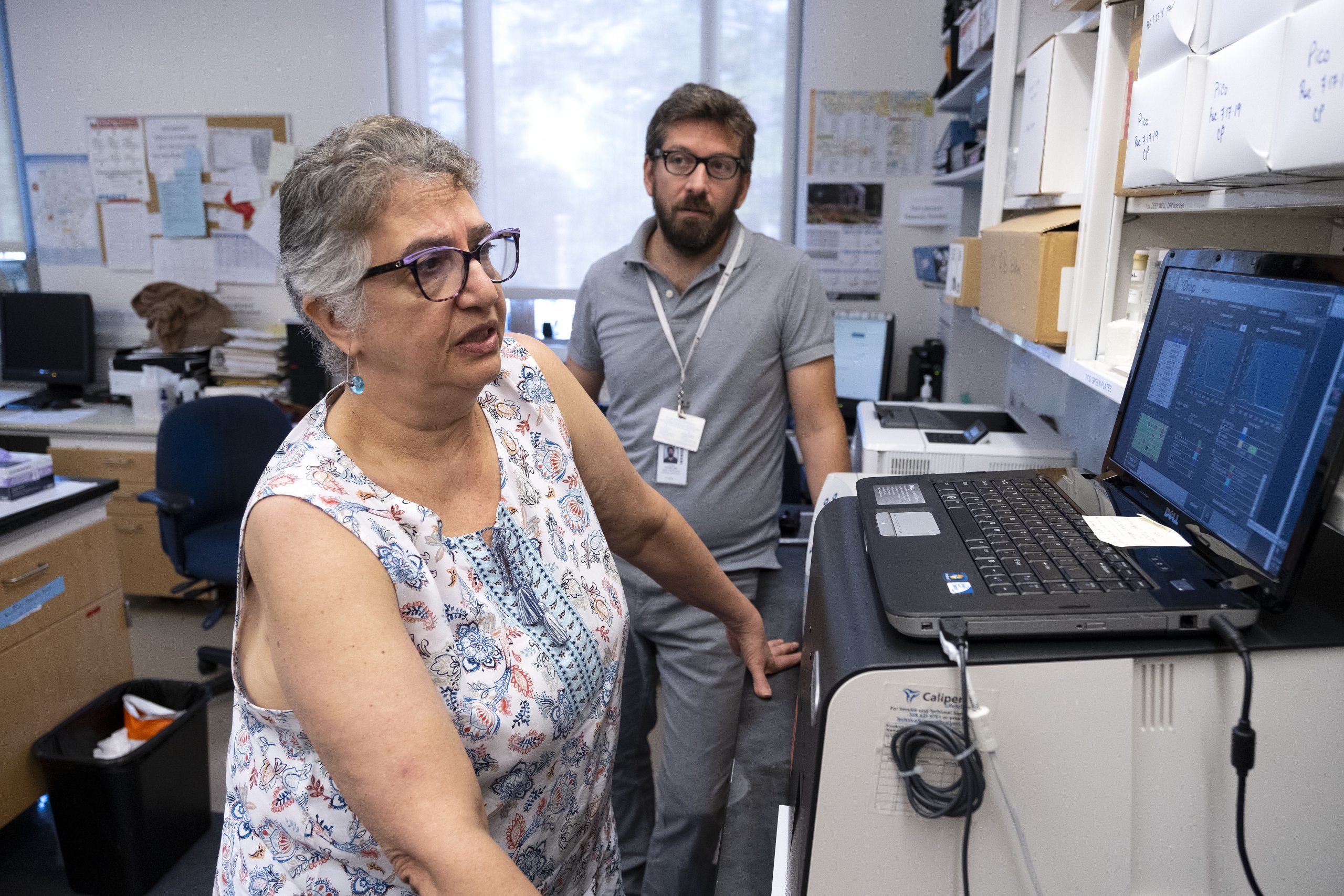 Patricia Basta (shown here with Kimon Divaris) in the Michael Hooker Research Center