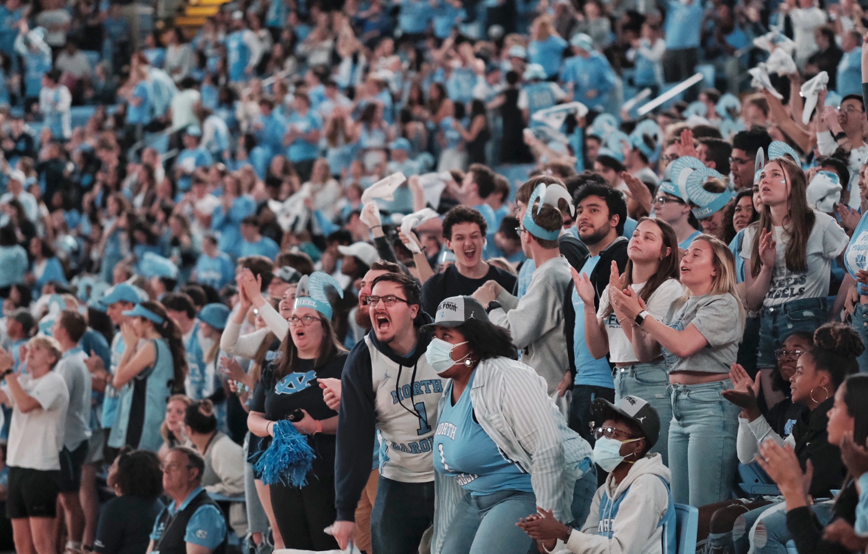 Fans in the Smith Center cheering the Tar Heels