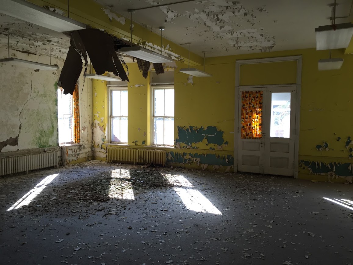 A delapidated interior room in Broughton Hospital.