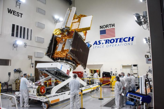 The SWOT spacecraft is moved into a transport container inside the Astrotech facility at Vandenberg Space Force Base in California on Nov. 18, 2022