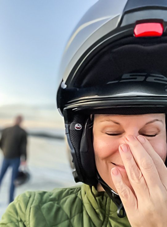 woman in motorcycle helmet