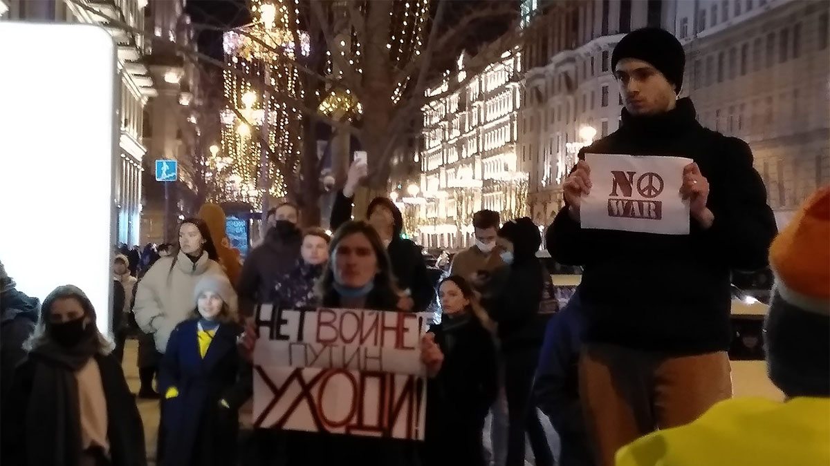 people protesting and holding signs
