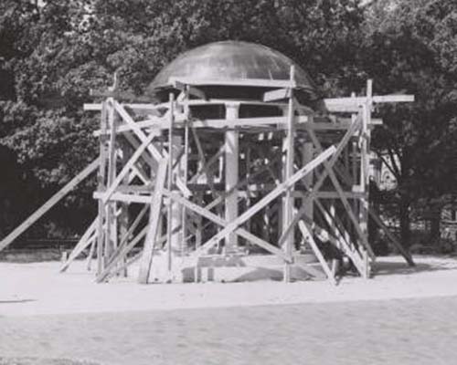 Old Well under construction in 1954 with numerous wooden beams supporting it.