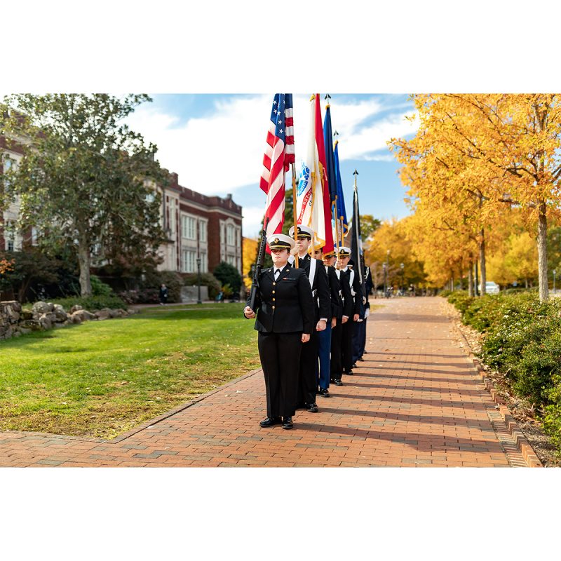 Members of Carolina ROTC hold flags during a Veterans Day ceremony outside Memorial Hall.