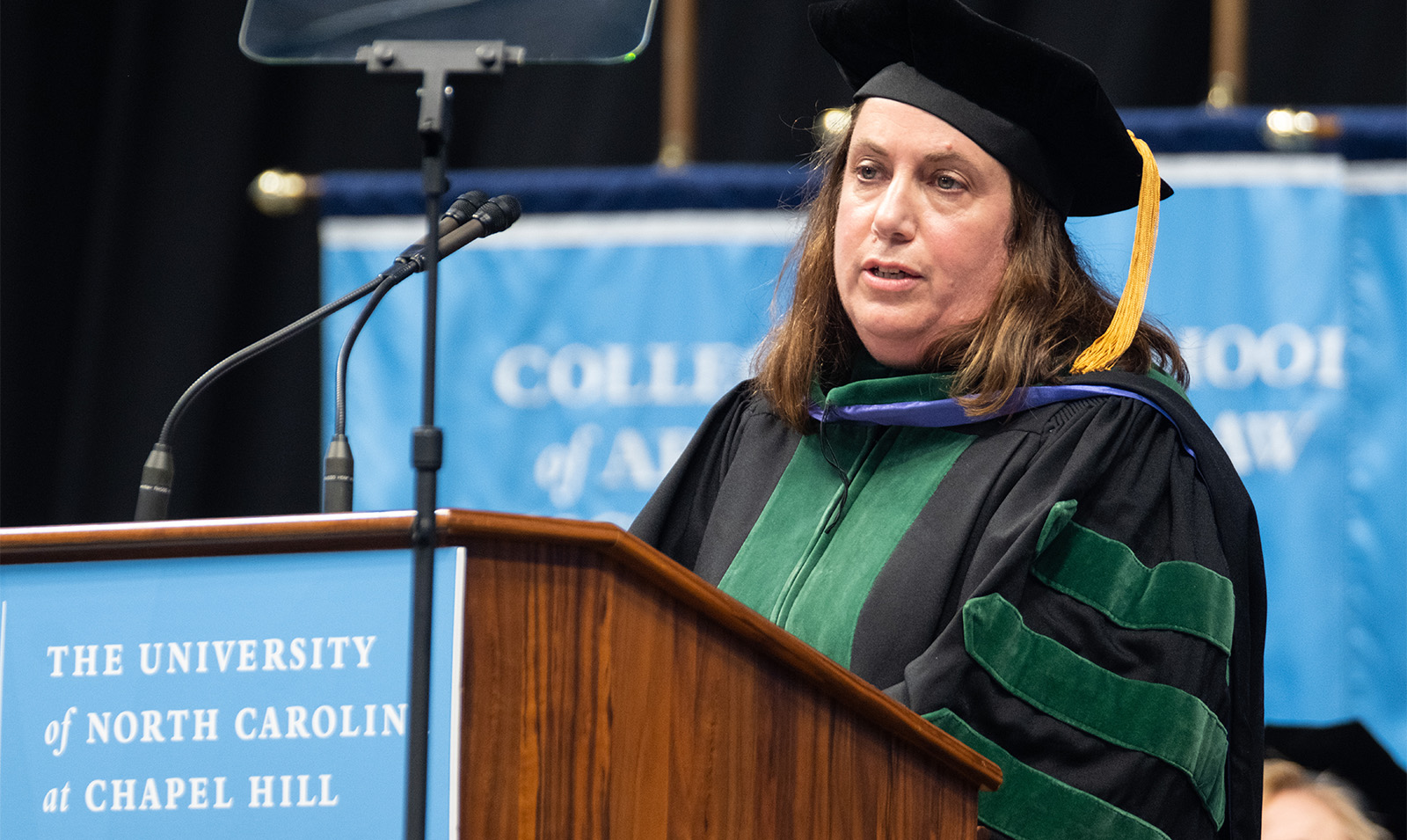 Dr. Samantha Meltzer-Brody speaking at a dais at Winter Commencement.