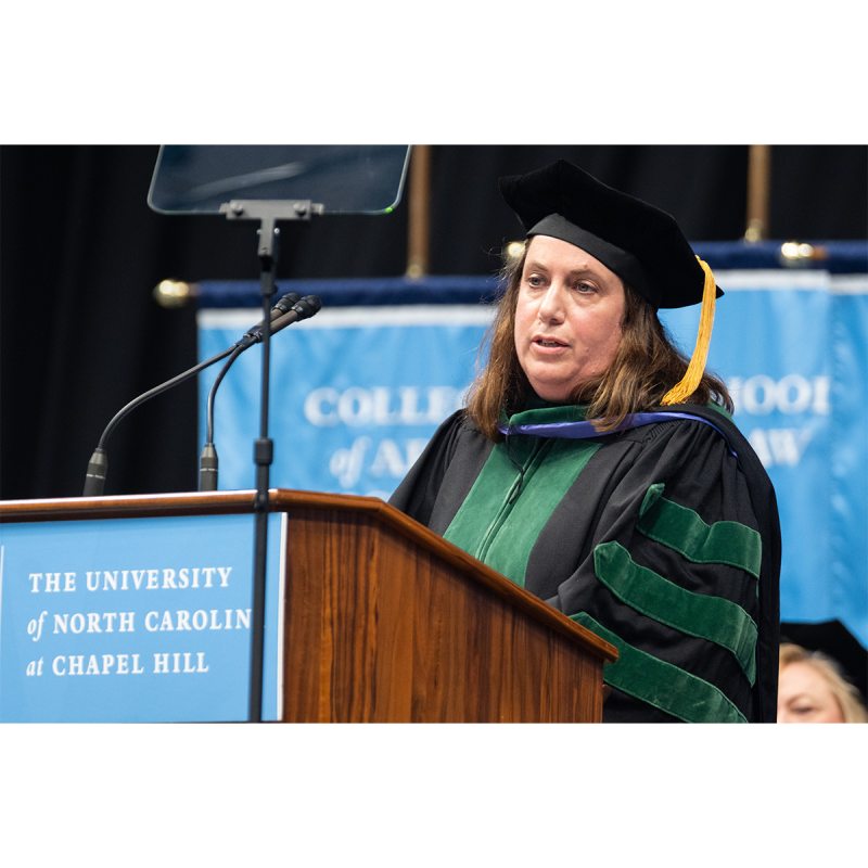 Dr. Samantha Meltzer-Brody in regalia and speaking at a dais at Winter Commencement.