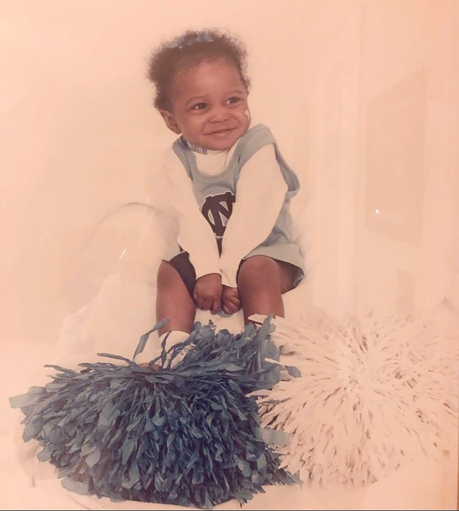Brooklyn Rushing as a toddler in a Carolina cheer outfit. 