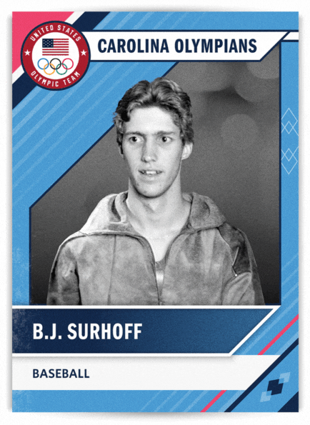 Front of card: B.J. Surhoff. Baseball. Surhoff, a catcher for the Diamond Heels, was on the U.S. silver-medal squad in Los Angeles (1984). He had two home runs and 13 RBIs. In 1983 he won international medals with a silver at the Intercontinental Cup and a bronze at the Pan American Games. Milwaukee Brewers chose him first overall in 1985 MLB draft. Played catcher, left field and first base. His career (1987-2005), he also played for the Atlanta Braves and made a 1999 All-Star Game appearance. His career included a .282 batting average, 188 home runs and 1,153 RBIs. UNC years: 1983-85. First Tar Heel to earn back-to-back first-team All-America honors (1984-85). 1985 “Sporting News” Player of the Year. First UNC player ever to hit .400. Elected to College Baseball Hall of Fame in 2010 
