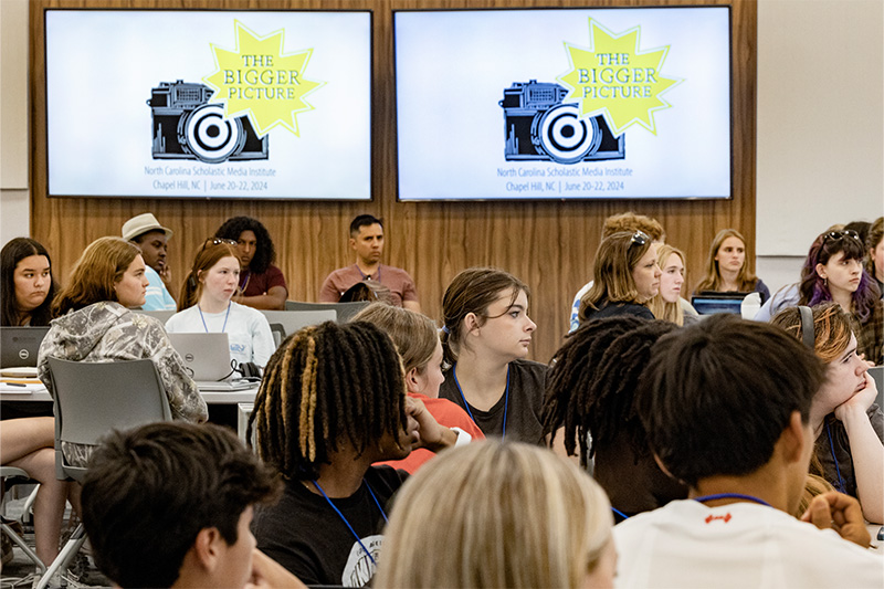 High school students in a large lecture hall at a journalism camp on the campus of UNC-Chapel Hill.
