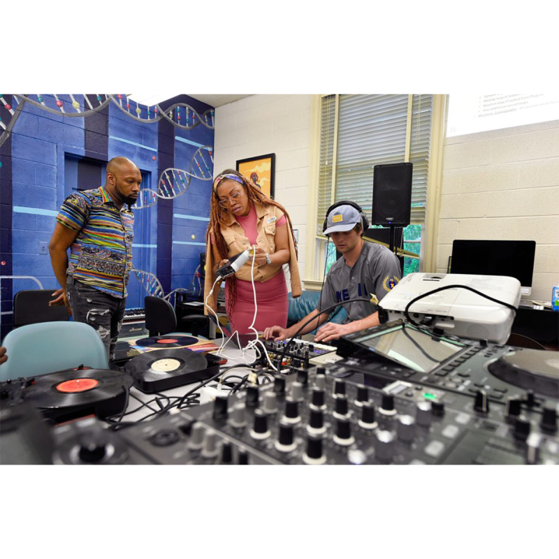 (Professor Maya Shipman (Suzi Analogue) and another instructor work with a student in the Beat Lab at the Carolina Hip Hop Institute summer 2024.