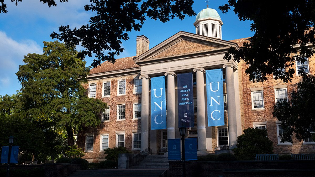 Tree branches framing south building on UNC.