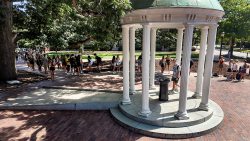 Students line up to take sip from Old Well