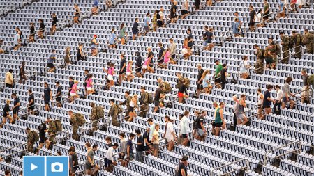 UNC-Chapel Hill community members climbing up stadium steps at Kenan Stadium at a 9/11 Memorial Climb.