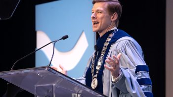 Chancellor Lee H. Roberts giving a speech during his installation on the stage at Memorial Hall on the campus of UNC-Chapel Hill.