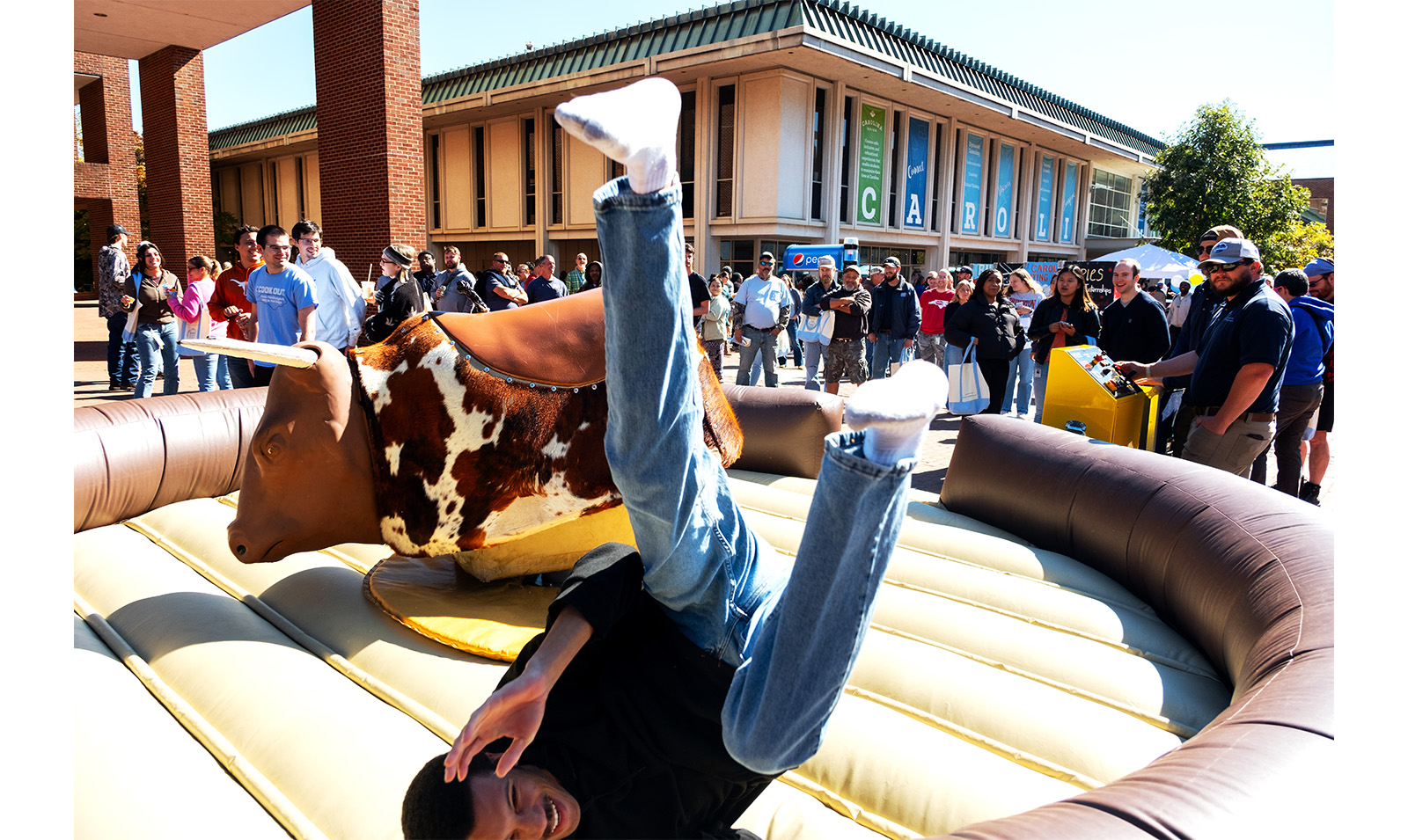 Carolina employee falls off mechanical bull in the Pit during Employee Appreciation Dau