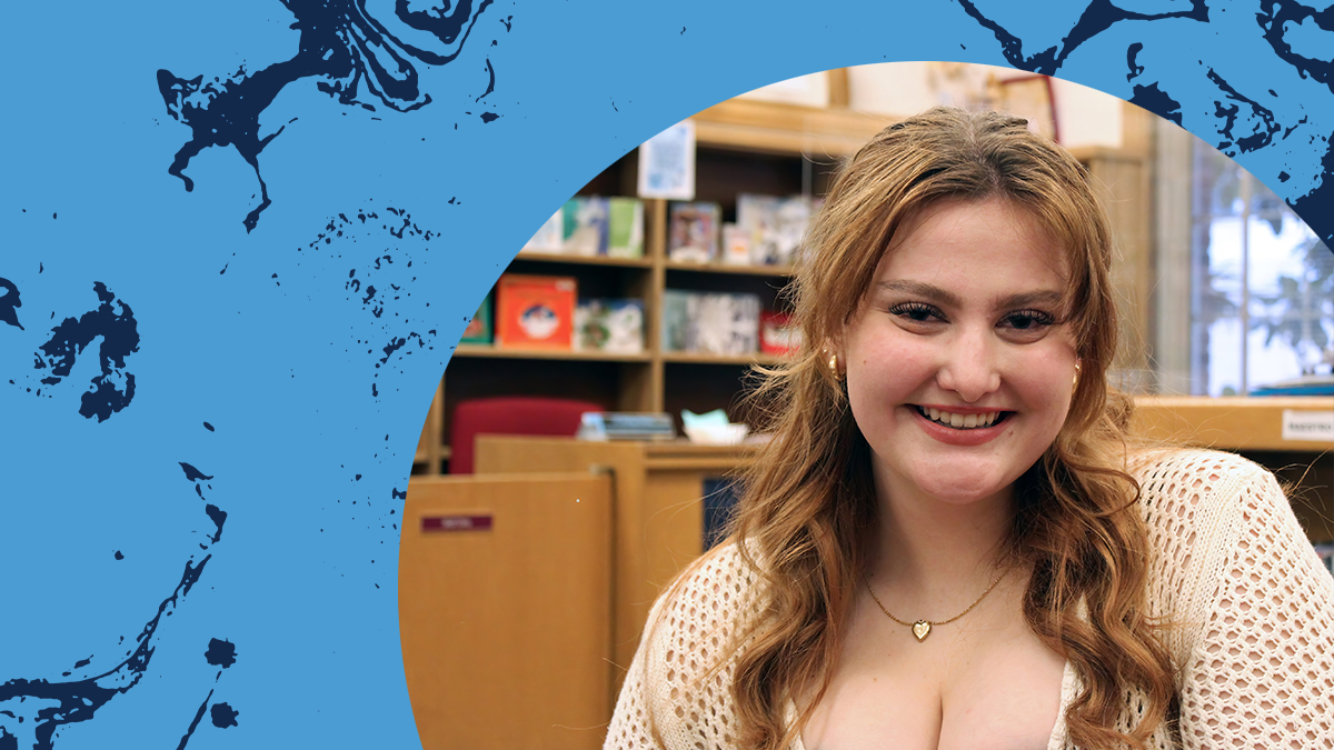 Headshot of Julia Crume against Carolina Blue background.