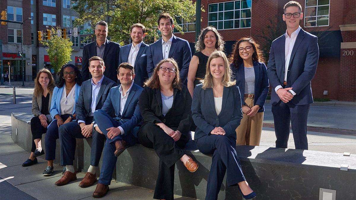 Group photo of Carolina’s Operational Excellence team outside of their office.