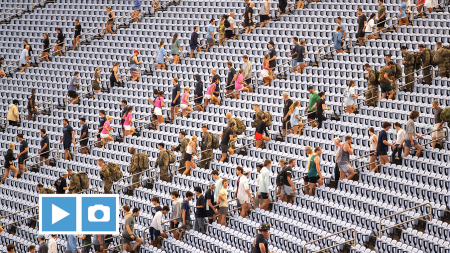 UNC-Chapel Hill community members climbing up stadium steps at Kenan Stadium at a 9/11 Memorial Climb.