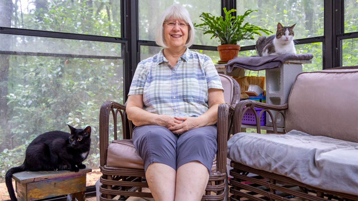 Patricia Sawin with her two cats.