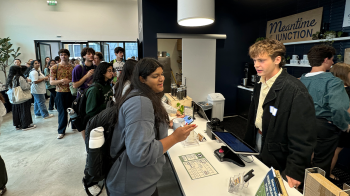 A long line of students and community members waiting to order at Meantime Coffee's newly opened Junction location.